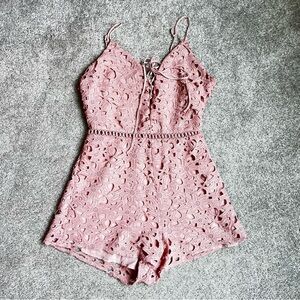 Pink lace look romper size small from Kendal and Kylie